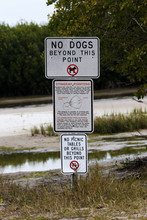 Warning And Caution Sign At Fort Desoto Park Near St. Pete Beach, Florida.