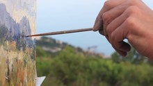 Artist Working En Plein Air. Oil Painting. Painting Outdoors, Capturing Natural Light In The Landscape, And Translating Those Qualities With Paint To Canvas. Mountain Landscape