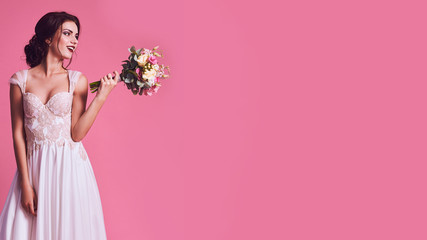 brunet bride portrait in pink studio