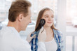 © zinkevych - Experienced specialist exploring patient skin with dermatoscope in the clinic