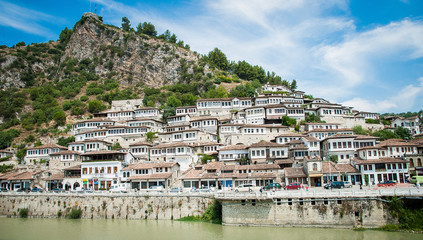 2016 Albania Berat - City of thousand windows, beautifull view of town on the hill between a lot of trees and blue sky