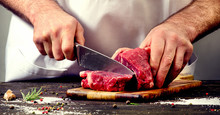 Man Cutting Beef Meat