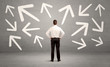 © ra2 studio - Confused salesman with arrows on wall