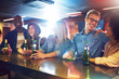 © Flamingo Images - People sitting in the bar and laughing