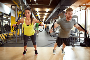 Wall Mural - Couple on body training in gym