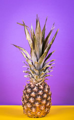 Wall Mural - Pineapple on a bright background;