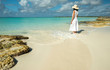 © forcdan - Woman in a caribbean lagoon
