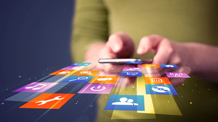 Aufkleber - Woman holding smart phone with colorful application icons