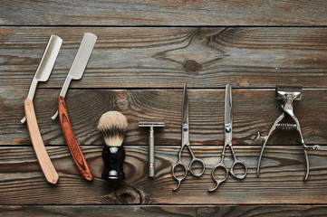 Vintage barber shop tools on wooden background