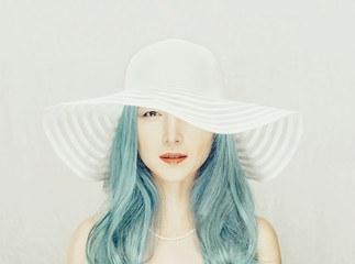 Poster - Beautiful woman with blue hair in a hat.