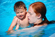 © Theresia Karanitsch - BadespaßEin Teenager und ein Baby im Swimmingpool.