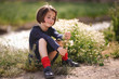© javiindy - Little girl sitting in nature field wearing beautiful dress