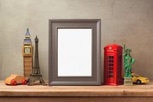 Travel And Tourism Concept With Photo Frame And Souvenirs From Around The World