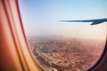 Evening Cityscape Of Dubai Through Aircraft Window