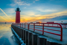 Red Lighthouse At Sunrise