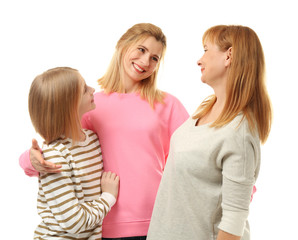 Wall Mural - Happy young woman with her mother and daughter on white background