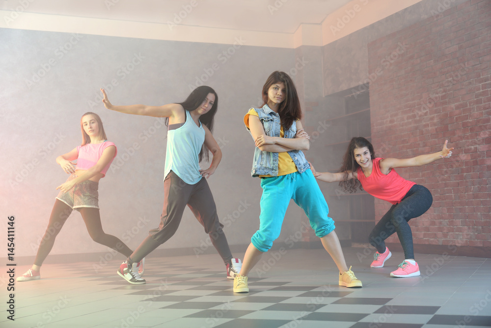 Group of young hip-hop dancers in studio