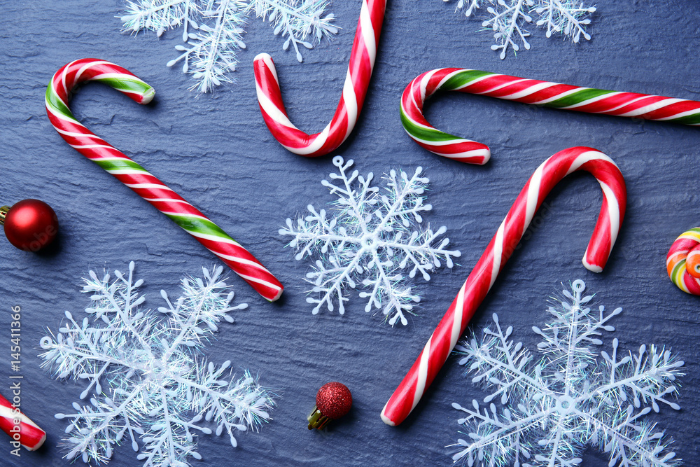 Christmas candy canes and decor on gray  background