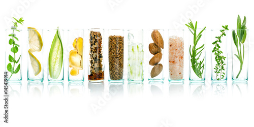 Fotomural Homemade skin care with natural ingredients aloe vera, lemon, cucumber, himalayan salt, peppermint, rosemary, almonds, cucumber, ginger and honey pollen isolated on white background