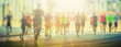 canvas print picture - colorful silhouettes of people running in the city 