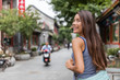 © Maridav - Beautiful asian model smiling laughing healthy living. Happiness and joy lifestyle. Chinese woman in elegant red silk dress dancing and running in china travel.