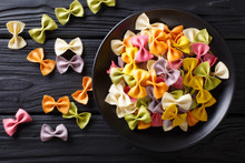 Beautiful Italian Uncooked Colored Farfalle Pasta Close-up. Horizontal Top View