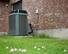 High Efficiency Modern AC-heater Unit On Brick Wall Background