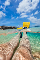 Wall Mural - Split photo of  woman legs with fins