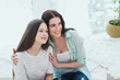 © alexsokolov - Beautiful mother and her pretty daughter teenager smiling and posing at home