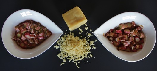 Ingredients for rhubarb crumble - step 2 - baked rhubarb topped with grated marzipan