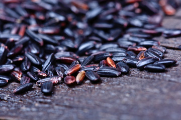 Wall Mural - Heap of black rice on table