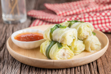 Cabbage stuffed with meat on plate.