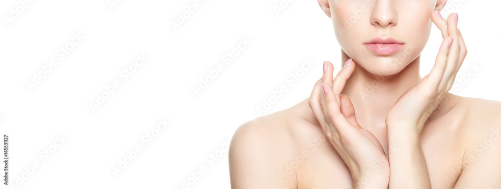 Beautiful Young Blond Woman with Perfect Skin touching her face. Facial treatment. Cosmetology, beauty and spa concept. Isolated on white background. - obrazy, fototapety, plakaty 