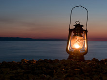 Petrol Lamp At Night On The Beach