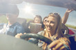 © Syda Productions - happy friends driving in cabriolet car