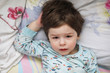 © alexkich - Portrait of a young child lying on a pillow