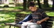 © Kitreel - nice teenager 14 years old studying in the park in a sunny day. healthcare and lifestyle concept.