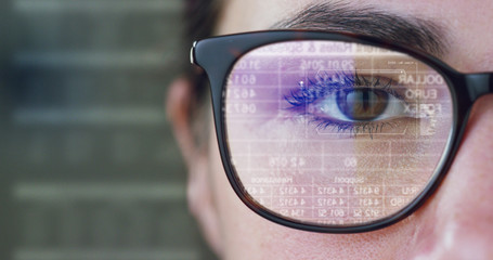 A woman watches with a futuristic look with glasses. augmented reality in holography.	