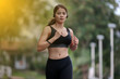 © tuiphotoengineer - Running woman. Female runner jogging during outdoor  on road .Young mixed race girl jogging