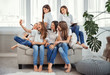 © svetabezu - Group of teenage girls is making a selfie. Kids with phones, tablets and headphones.