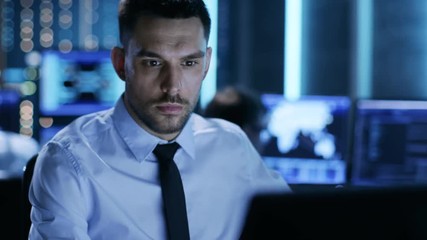 Aufkleber - Close-up of a Professional Technical Controller Sitting at His Desk with Multiple Displays Before Him. Shot on RED EPIC-W 8K Helium Cinema Camera.