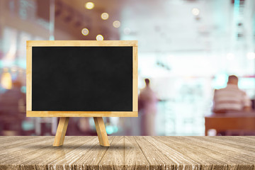 Aufkleber - Blackboard menu with easel on wooden table with blur restaurant background, Copy space for adding your content