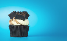 Chocolate Brownie Cupcake On Blue Copy Space Background
