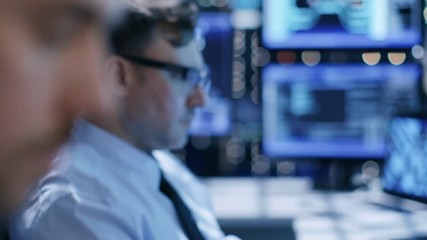 Poster - In the System Control Center Team of Technicians Monitor System Stability. Close-up Faces Footage. Possible Air Traffic/ Power Plant/ Security Room Theme. Shot on RED EPIC-W 8K Helium Cinema Camera.