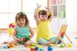 © Oksana Kuzmina - Little kids play with abacus and constructor toys, early learning
