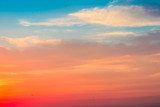 Fototapeta Zachód słońca - Beautiful dramatic sunset sky with red orange pink purple colors and birds. Natural background