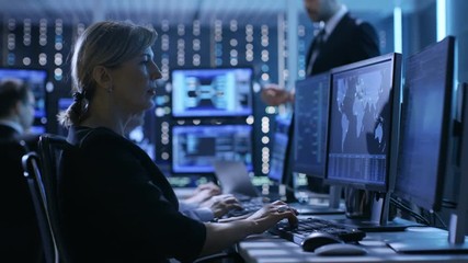 Aufkleber - Supervisor Holds Briefing for His Employees in System Control Center Full of Monitors and Servers. Possibly Government Agency Conducts Investigation. Shot on RED EPIC-W 8K Helium Cinema Camera.