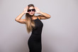 © F8  \ Suport Ukraine - Portrait of Fashion portrait of young beautiful woman in the black dress on grey