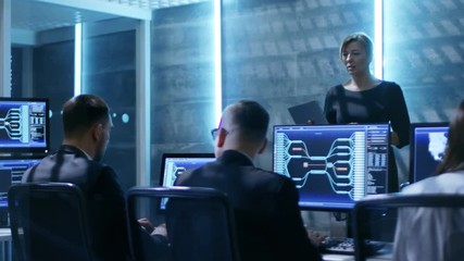 Poster - In The Government System Control Center. Female Supervisor with Laptop Holds Meeting For Her Team of Engineers. Shot on RED EPIC-W 8K Helium Cinema Camera.