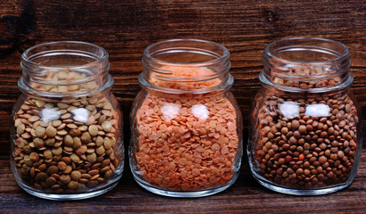 Wall Mural - Different types of lentils in a jars on table